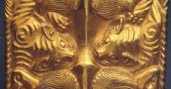 Gold plaque showing four tigers eating an ox Warring States(475-221 BC)Length 12.7 cm, Width 7.4 cm, Weight 237.625 g Excavated in 1972 from Aluchaideng, Hanggin Banner, Inner Mongolia