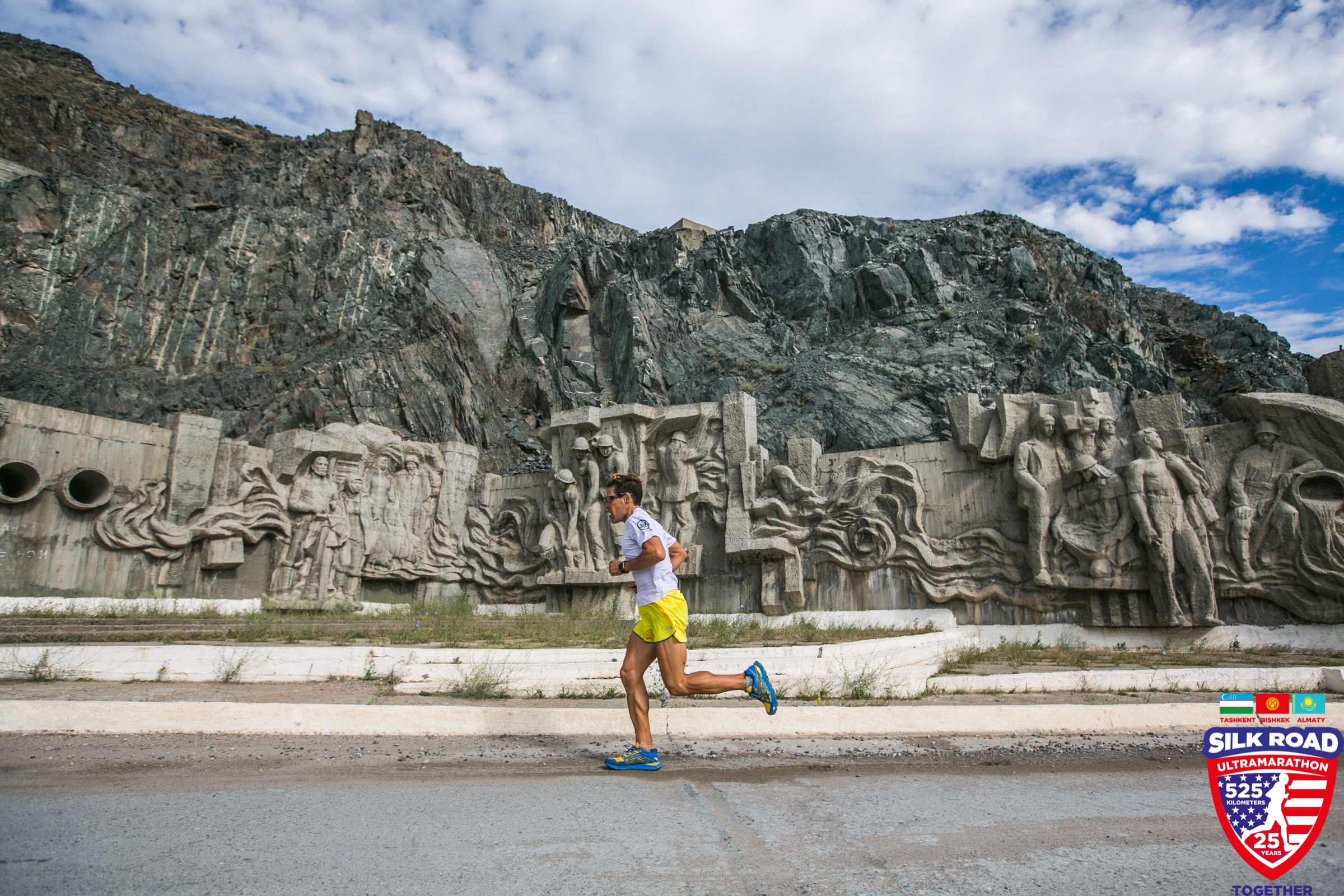 Dean running in front of monument 