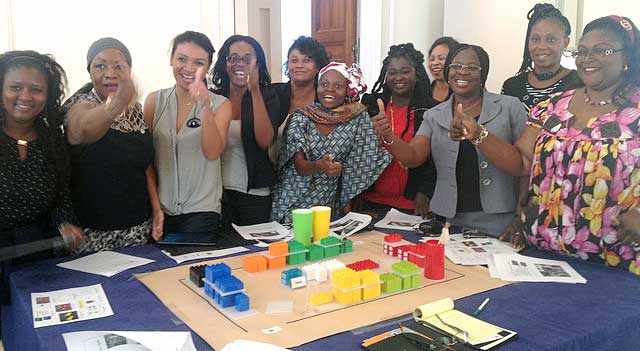 The women visitors working on Lego project