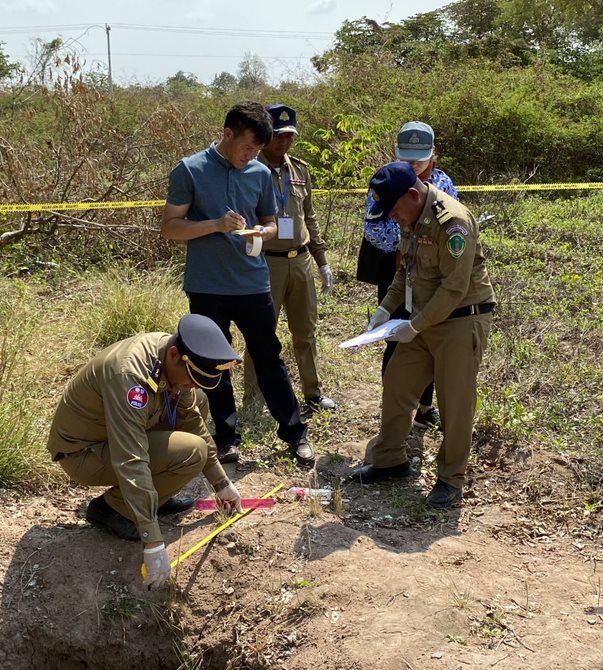 Cambodian heritage police and archaeologists work together to document a crime scene – looting at an archaeological site (U.S. Department of State)