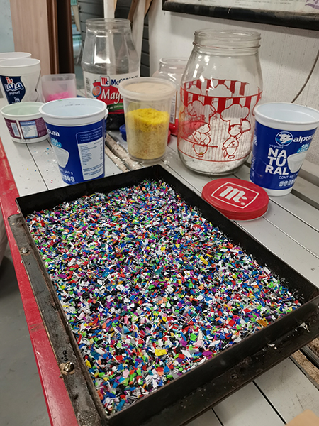 Part of the process involves melting plastic down to remold it into a new shape. (Photo Credit María Rojas)