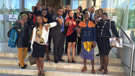 MWF alumni and their Mentees at the Namibia Connect Camp for the Young African Leaders Initiative, showing hands in the shape of Namibia.