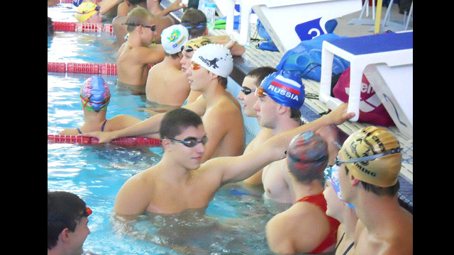 Despite their different backgrounds and homes, the swimmers communicate well during practice.