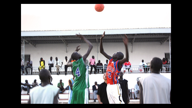 The boys start the game with a tip-off.