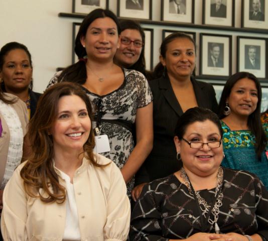 Assistant Secretary Ryan poses with the women in the program
