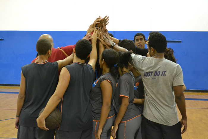 After a friendly scrimmage, the group comes together for a cheer. 