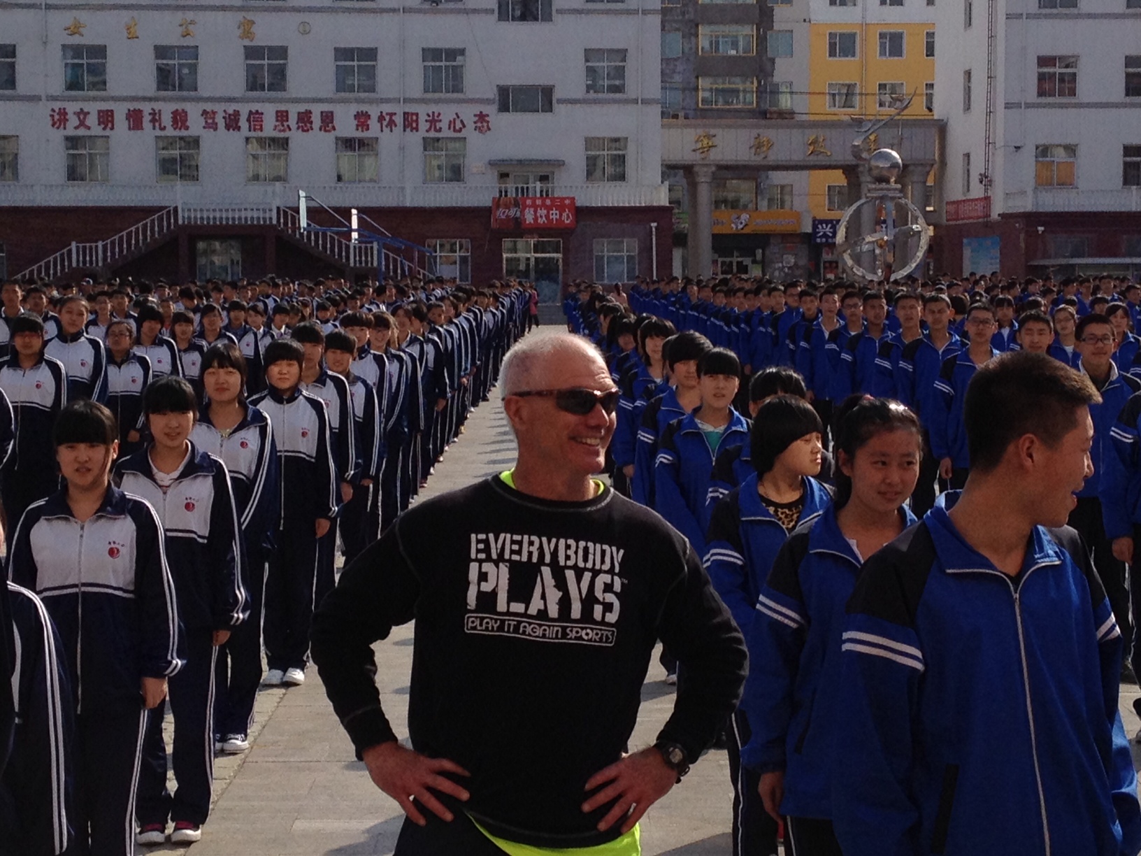 An American participant leads the Chinese youth in some exercise activities. 