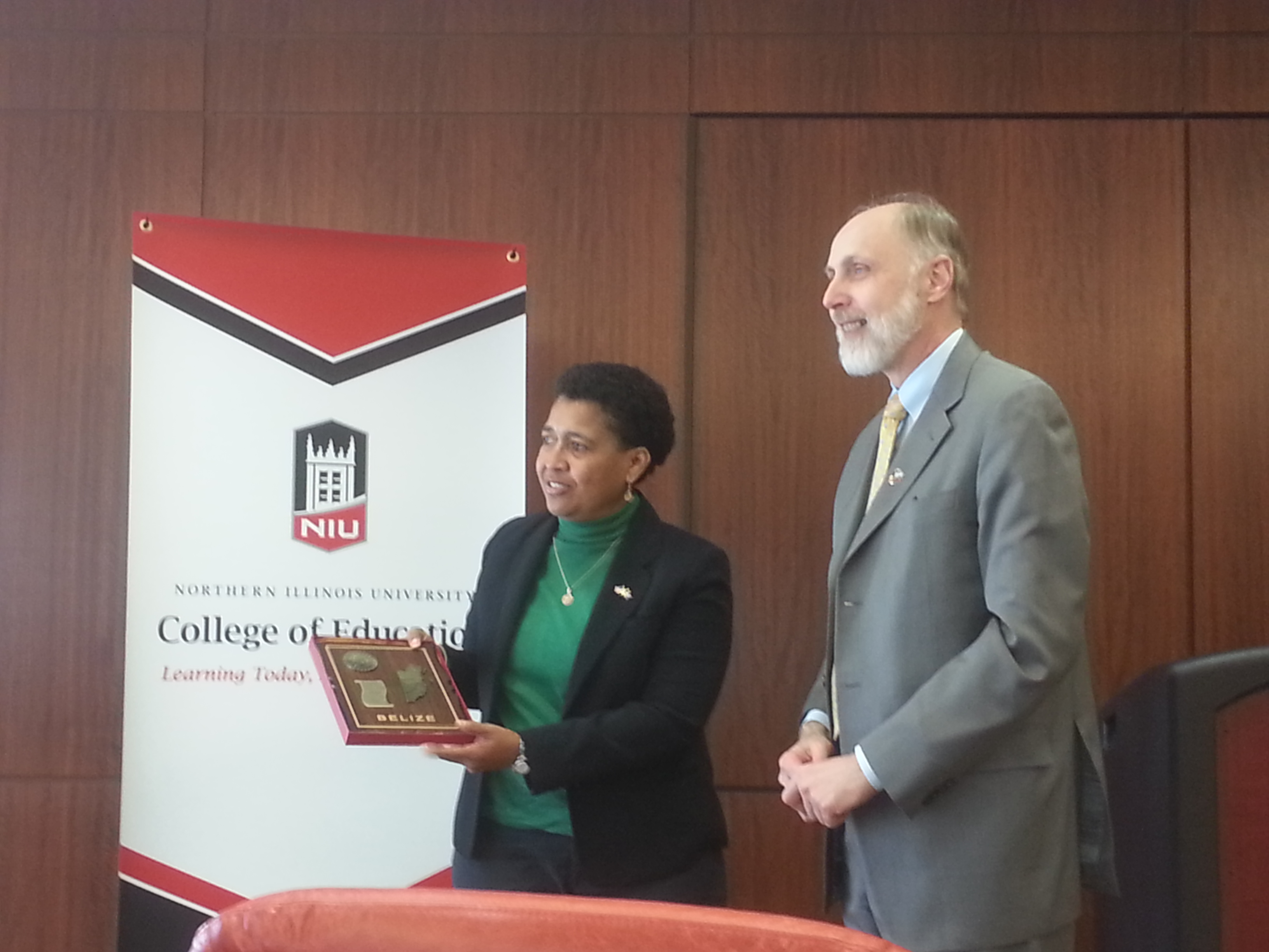 Delegate Clara Cueller presenting a gift to President Baker
