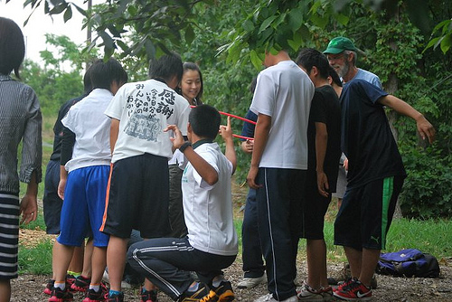 The participants do team building exercises to break the ice.