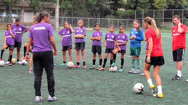 Players on a girls under-13 team take part in a clinic with the envoys, followed by a Q&A session on the differences and similarities in American and Brazilian sports programs.