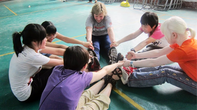 Dr. Clark teaches leadership skills to students at Peiying Vocational School.