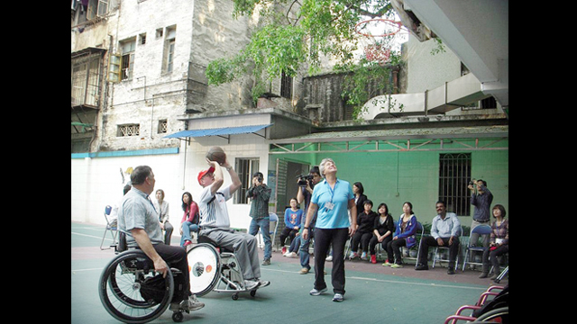 Consul General, Brian L. Goldbeck, participates in a demo at the Guangzhou English Training Center for the Handicapped in China.