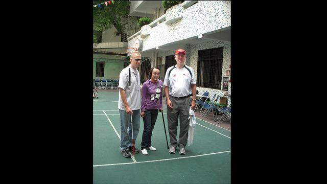 Consul General, Brian L. Goldbeck, poses with two participants from China and the U.S.