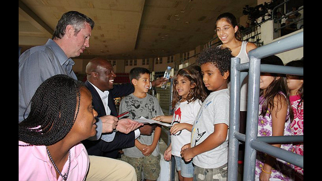 Marty Conlon and Sam Vincent sign autographs in Jordan.