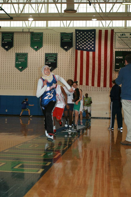 Nour from Tunisia warms up before a clinic at a D.C. area high school.