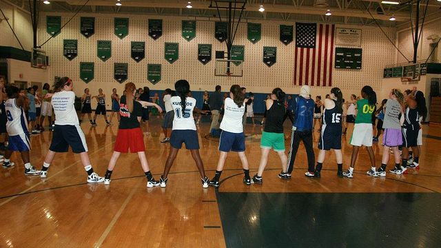 The group stretches with other American teenagers after an intensive practice.