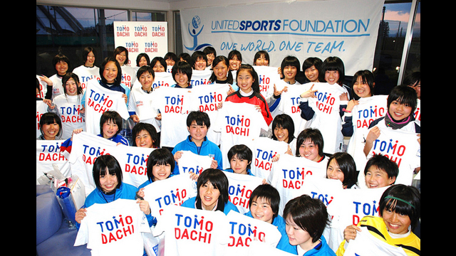 These young girls hold up their "TOMODACHI" shirts to represent the initiative to strengthen the friendship between Japan and the U.S.
