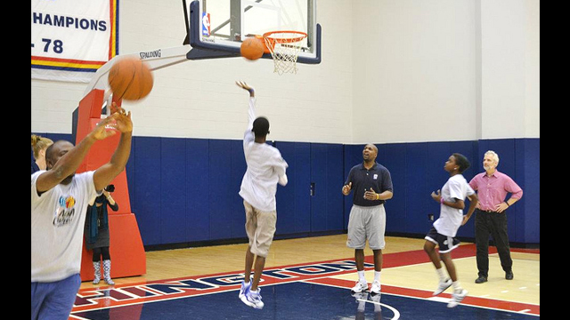 Participants line up for lay ups at an NBACares Clinic.