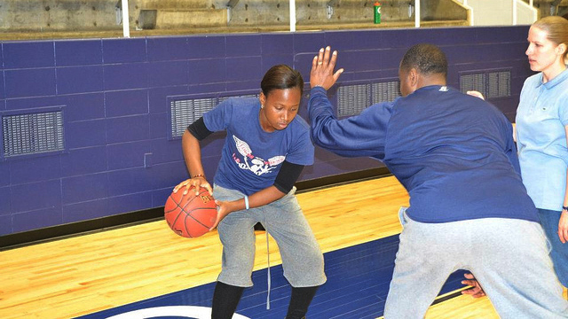 The young athletes from the DRC participate in dribbling drills at a Howard University Clinic