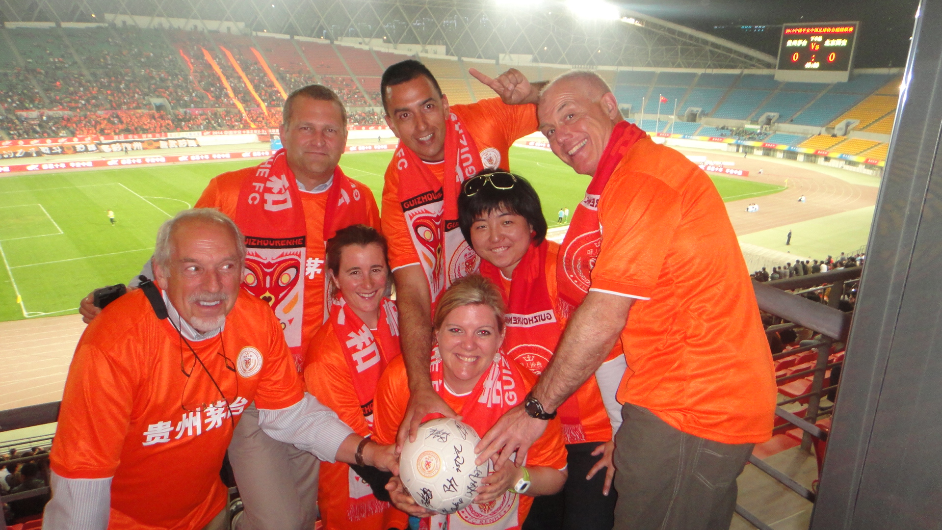 The Americans all decked out in their apparel to support a Chinese soccer team.