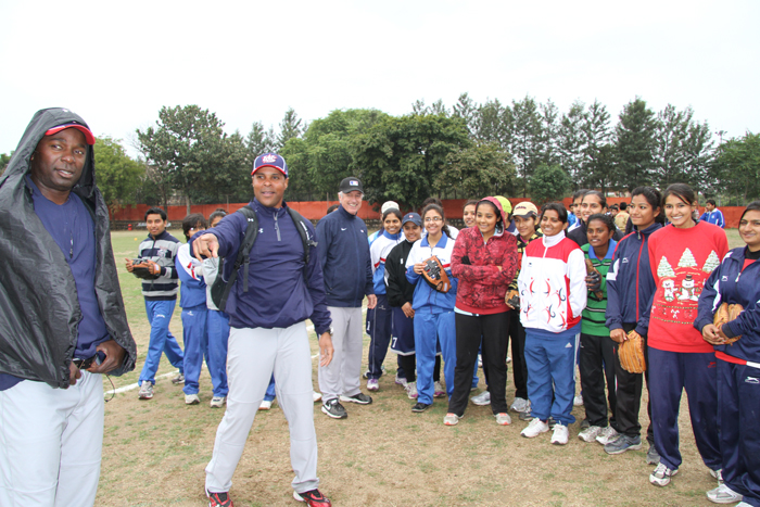 Barry Larkin, Joe Logan, and young athletes in India participate in pre-clinic demonstrations.