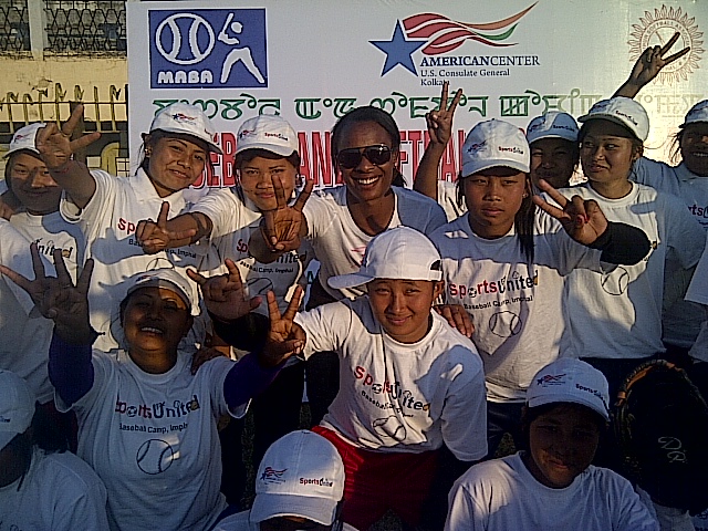 Natasha Watley joins the group for a photo.