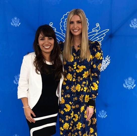 Young woman standing next to tall woman with long blonde hair