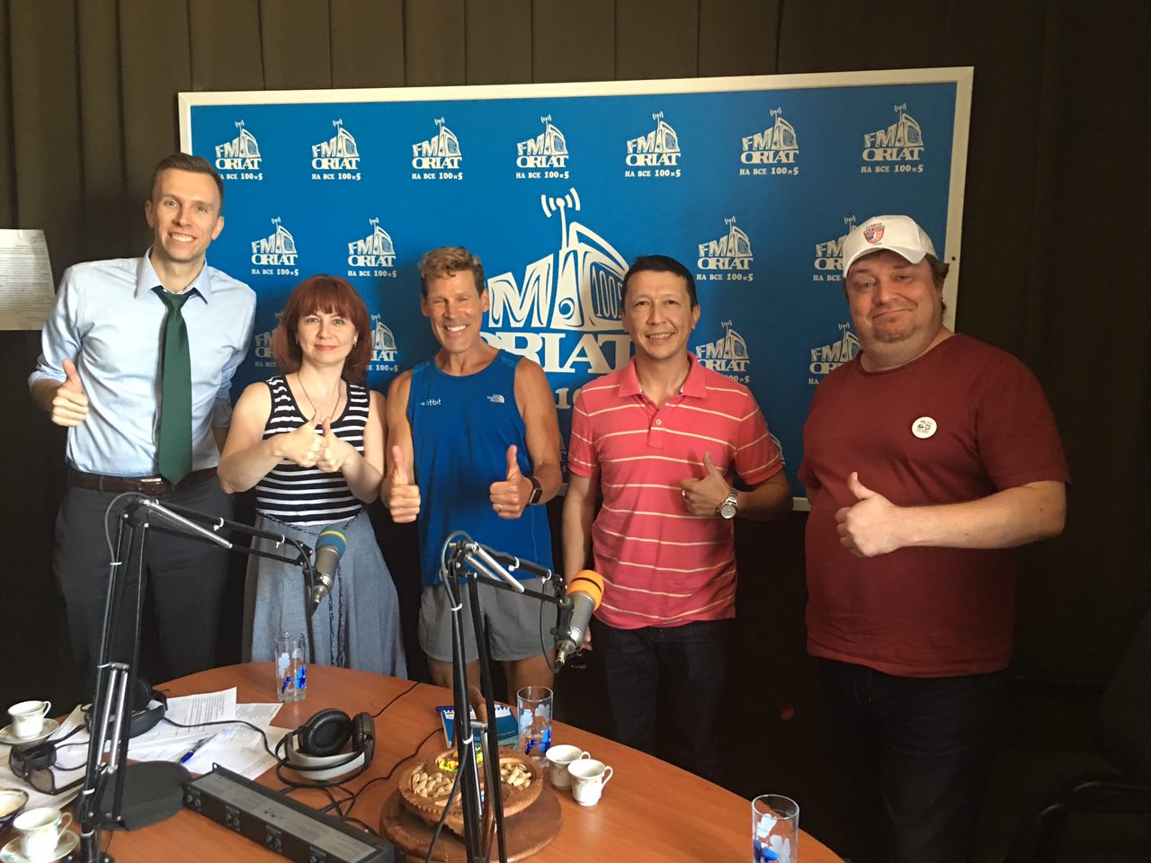 Dean and the radio crew give a thumbs up in this group photo