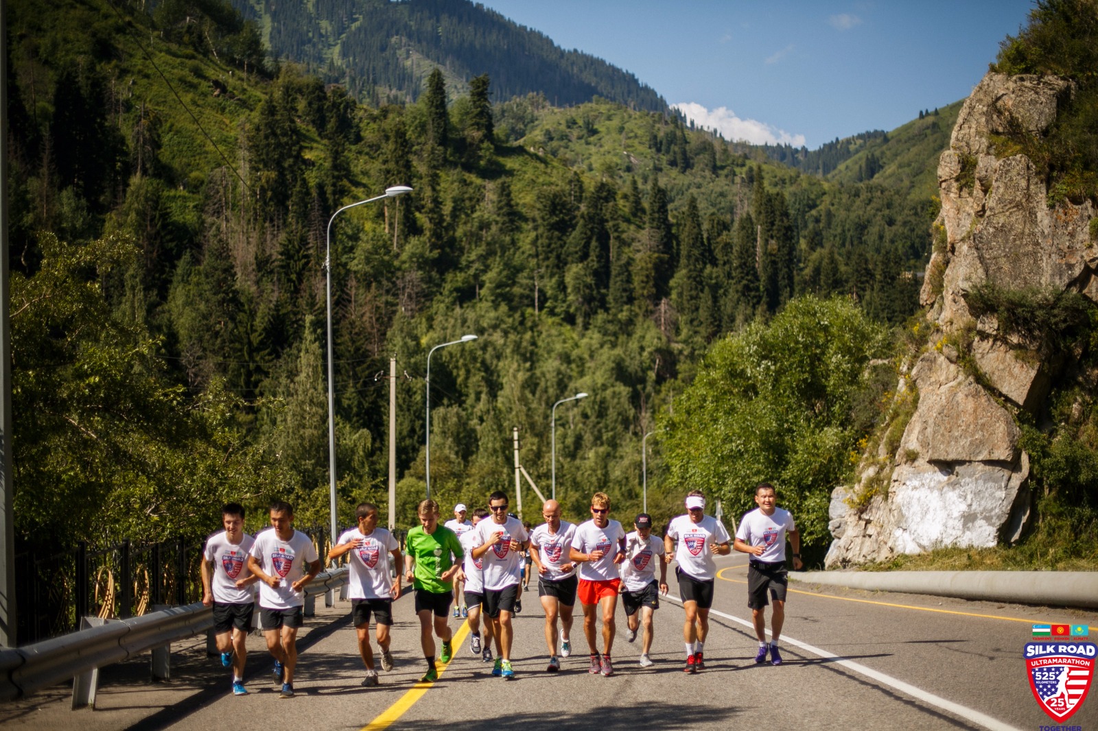 Dean running along highway through the mountains