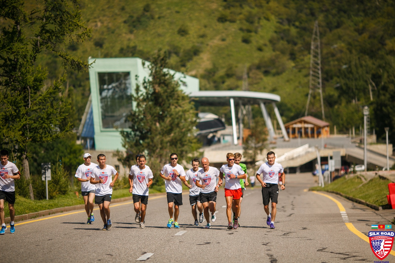 Dean running along highway through the mountains