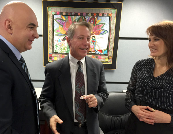 Rep Wenstrup smiling during conversation with two participants