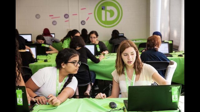 photo of two techgirls particpants working