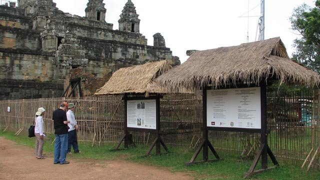 At Angkor in Cambodia, visitors learn about the work underway to preserve the 10th-century Phnom Bakheng temple.