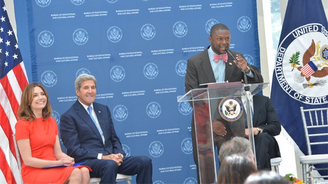Young black man speaking at a State Department podium