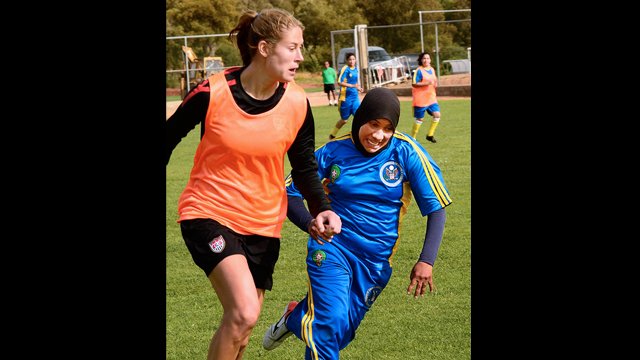 Marian Dalmy takes part in the soccer scrimmages.
