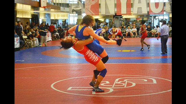 A member of the Mongolian wrestling team scores during the New York Athletic Club Holiday International Event.