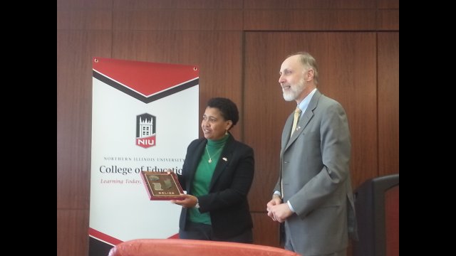 Delegate Clara Cueller presenting a gift to President Baker