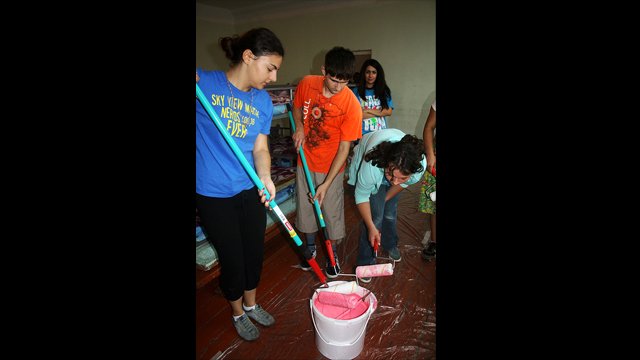 Second Place: "Painting Walls in an Orphanage"