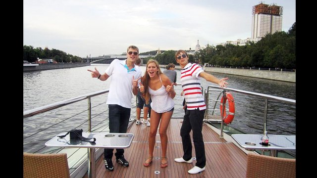 The American and Russian swimmers take a boat tour of Moscow, Russia.