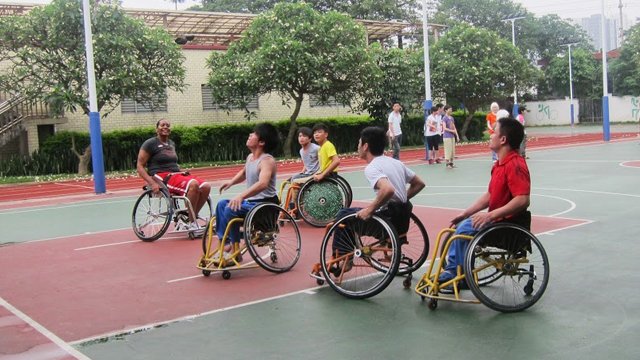 Students at Peiying Vocational School play wheelchair basketball with Sports Envoy Dr. Woodson-Smith.