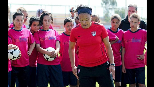 Angela Hucles trains the female coaches on footwork drills.