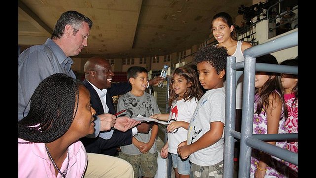 Marty Conlon and Sam Vincent sign autographs in Jordan.