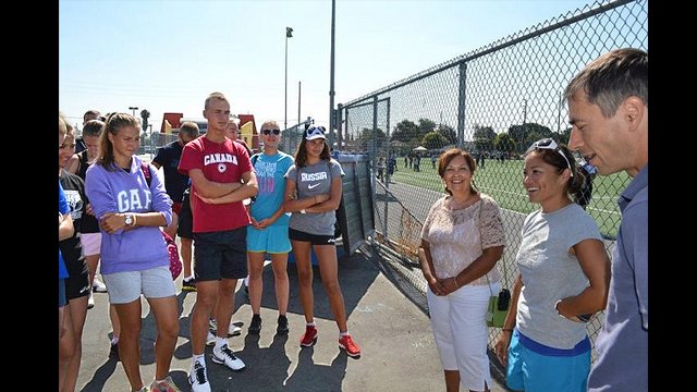 Sports Envoy, Olympic Medalist, and World Cup Champion Lorrie Fair talks to the Russian beach volleyball players.