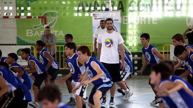 Greivis Vasquez tells the clinic participants to sweat it out.