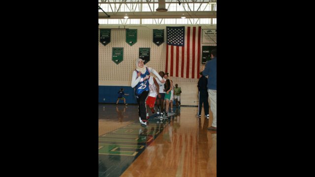 Nour from Tunisia warms up before a clinic at a D.C. area high school.