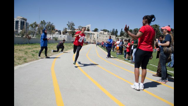 Run for Health, Run for Hope! Jackie waits to congratulate a runner at the finish line
