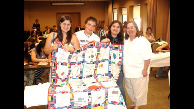 A-SMYLE students make and donate quilts for an orphanage.