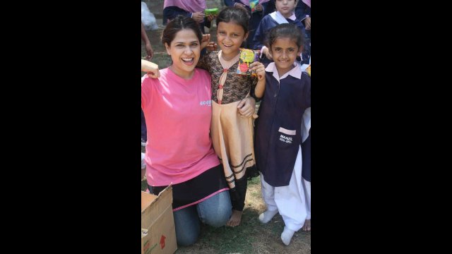 Fatima poses with a few of her young fans