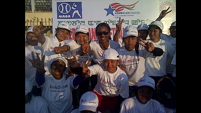 Natasha Watley joins the group for a photo.