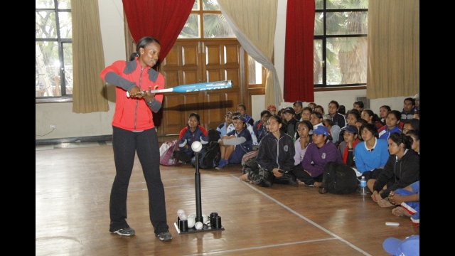 Sports Envoy Natasha Watley provides key tips on batting at a group meeting.   
